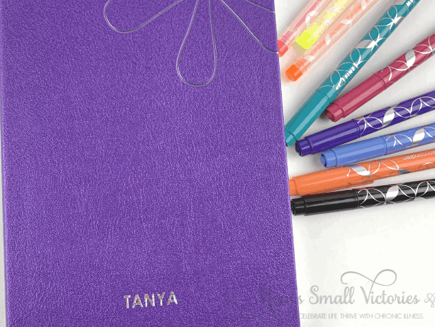 erin condren softbound notebook in shimmer purple. I'm thinking of using this for a decluttering journal so i can journal to improve my home