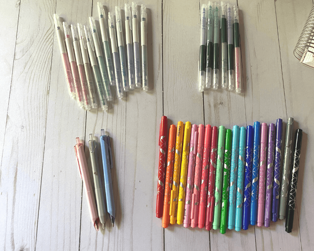 best pens to use in the Erin Condren planner. pictured are the ballpoint 3 pack, dual tip markers in various colors, pastel and black dual ink dual tip highlighter pens and dual tip/dual ink markers