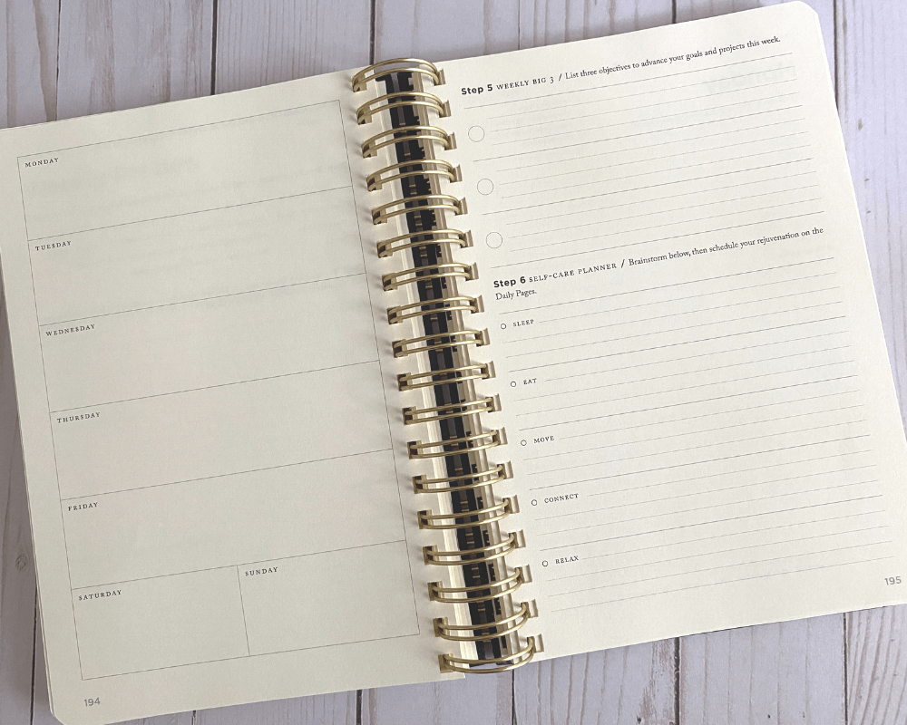 full focus planner review - wire bound planner with cream colored paper is open to the weekly preview pages with space for weekly overview, self care planner and top 3 priorities for next week